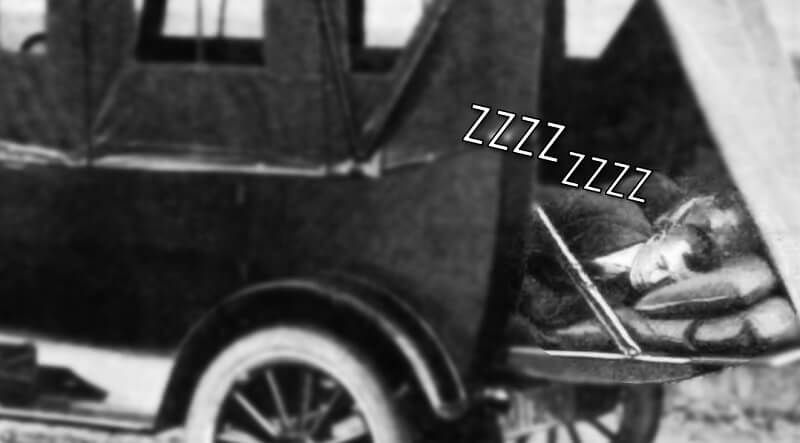 A man sleeping in a car